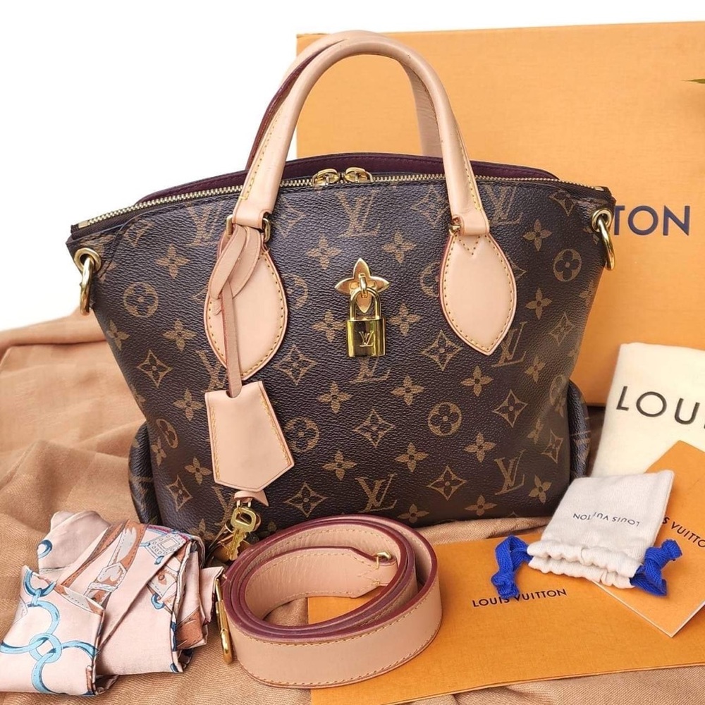 Louis Vuitton flower zipped tote.